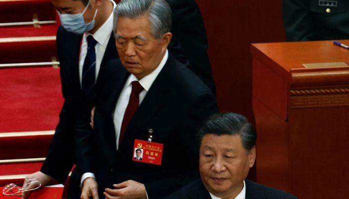 Former Chinese president Hu Jintao leaves his seat next to Chinese President Xi Jinping during the closing ceremony of the 20th National Congress of the Communist Party of China, at the Great Hall of the People in Beijing, China October 22, 2022.— Reuters