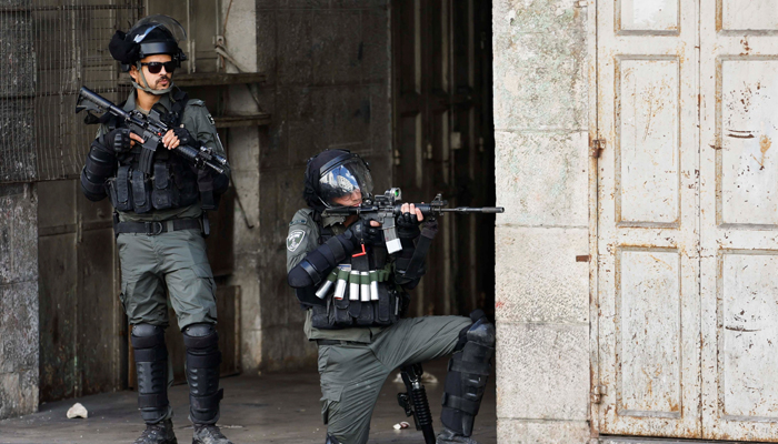 A member of the Israeli forces aims his weapon amid clashes with Palestinians during a protest in Hebron in the Israeli-Occupied West Bank October 14, 2022. — Reuters