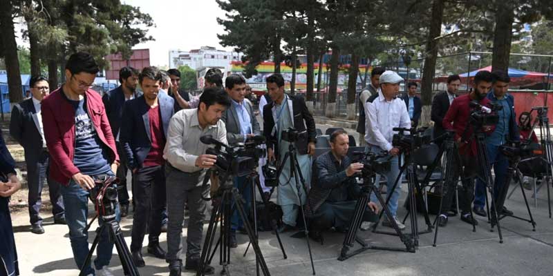 Journalists stand with their cameras for coverage of an event in Kabul. — AFP/File