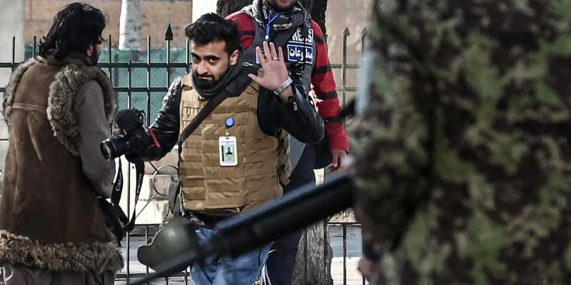 A journalist is seen being checked by security in Afghanistan. — AFP/File