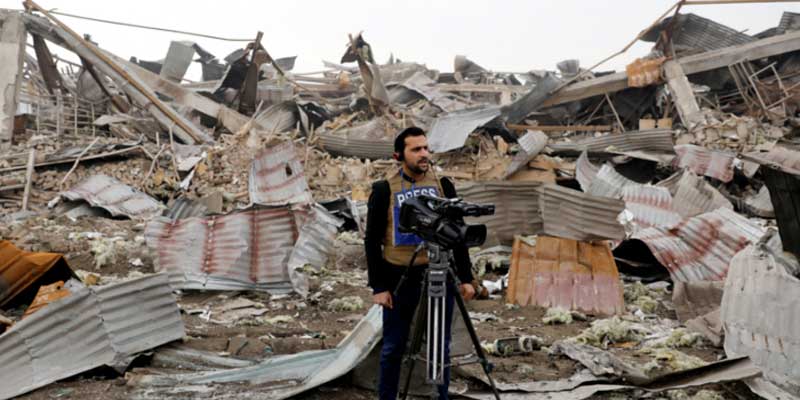 Afghan journalist reports from a site devastated by attacks in Afghanistan. — Reuters/File