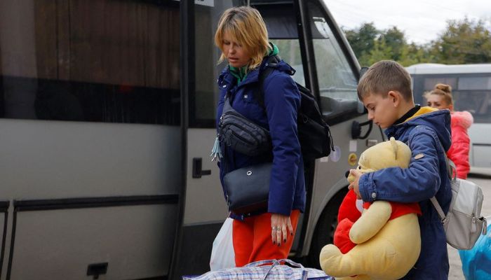 Civilians evacuated from the Russian-controlled city of Kherson wait to board a bus heading to Crimea, in the town of Oleshky, Kherson region, Russian-controlled Ukraine October 22, 2022.— Reuters