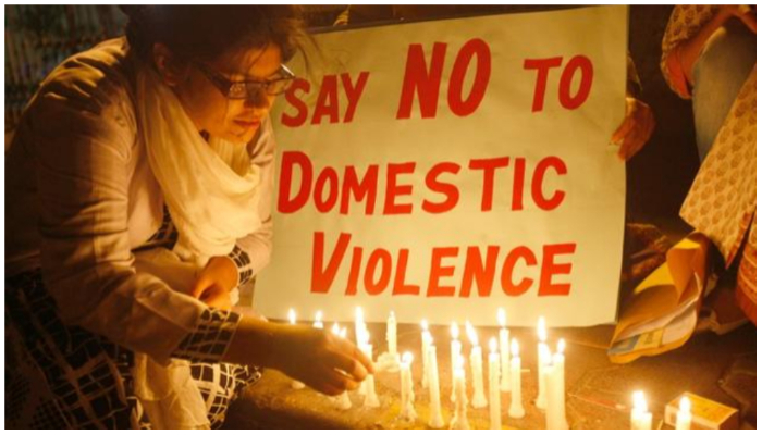 Image showing activists holding a vigil against domestic violence cases. — Reuters/ File