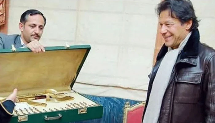 Former prime minister Imran Khan looking at the Toshakhana gifts he received during his tenure. — Twitter/ File