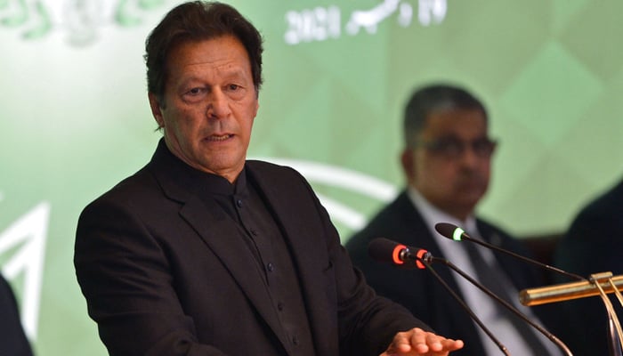 PTI Chairman Imran Khan addressing a conference. — AFP/File