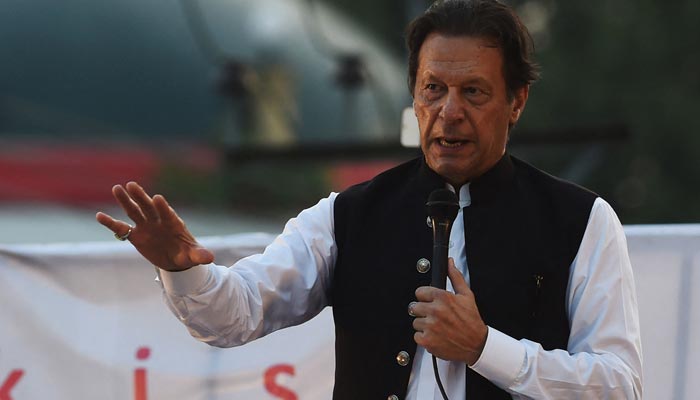 PTI Chairman Imran Khan addressing a rally. — AFP