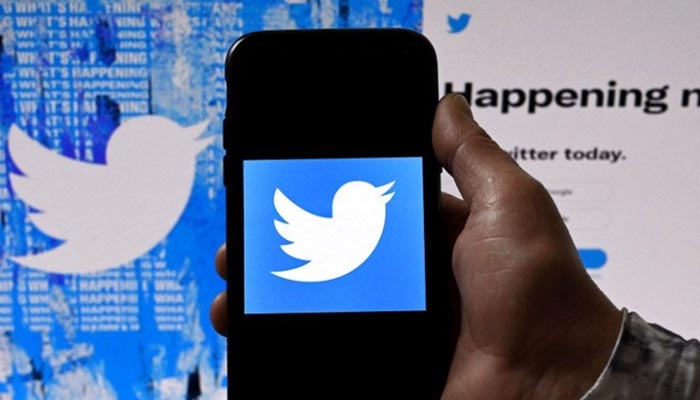 The Twitter logo seen on a mobile phone. — AFP