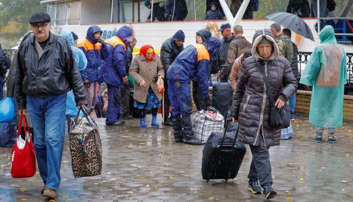 Civilians evacuated from the Russian-controlled city of Kherson walk from a ferry to board a bus heading to Crimea, in the town of Oleshky, Kherson region, Russian-controlled Ukraine October 23, 2022.— Reuters