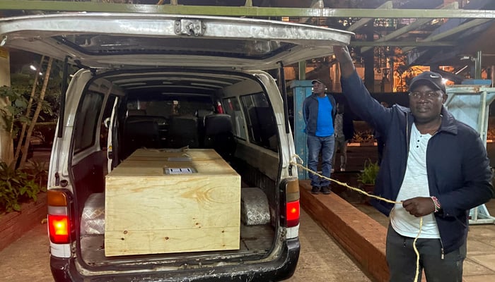 The wooden coffin containing the body of Pakistani journalist Arshad Sharif, who was shot dead when police hunting car thieves opened fire on the vehicle he was traveling in as it drove through their roadblock without stopping, is loaded into a courtesy van at the Chiromo mortuary in Nairobi, Kenya, October 24, 2022. —Reuters