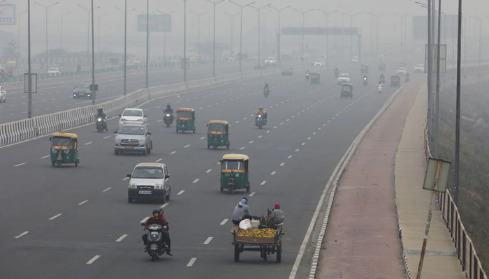 Vehicles are seen on a highway on a smoggy morning in New Delhi, India, December 2, 2021. — Reuters