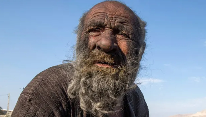 Amou Haji, photographed in 2018, feared that washing would make him ill. — AFP/File