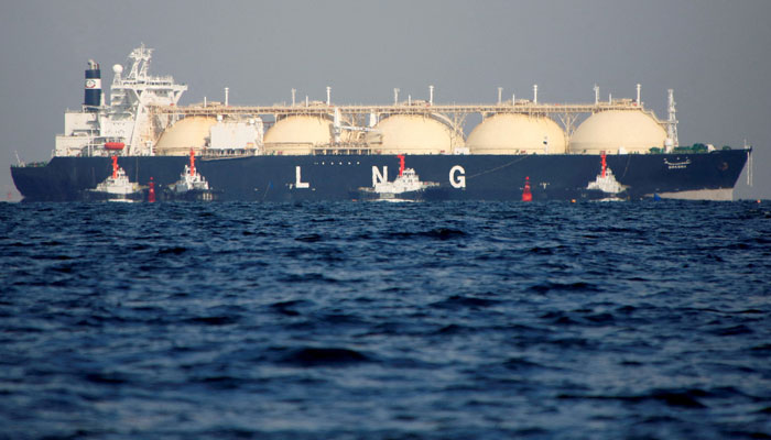 A liquefied natural gas (LNG) tanker is tugged towards a thermal power station. — Reuters/File