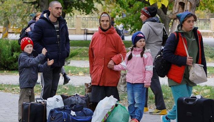 Civilians evacuated from the Russian-controlled city of Kherson wait to board a bus heading to Crimea, in the town of Oleshky, Kherson region, Russian-controlled Ukraine October 22, 2022. — Reuters