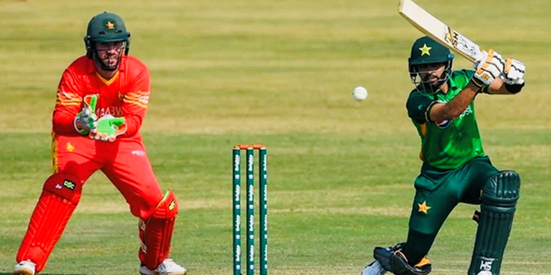 Pakistan captain Babar Azam plays a shot as Zimbabwe wicketkeeper looks on. — AFP/File