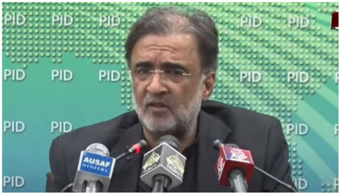 Adviser to the Prime Minister for Kashmir and Gilgit-Baltistan Qamar Zaman Kaira addressing a press conference in the federal capital. — Screengrab via YouTube/ PTV News Live