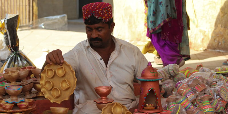 Mohammad Arif, a vendor selling clay items, in the compound adjacent to the Shri Swaminarayan temple. — Photo by author