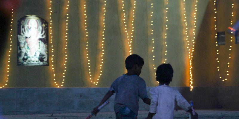 Children run toward the designated platform to light up firecrackers. — Photo by author