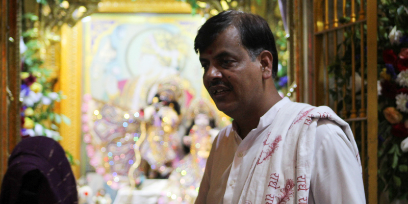 The temples chief priest Vijay Maharaj stands outside the prayer area after the end of the Lakshmi Puja. — Photo by author