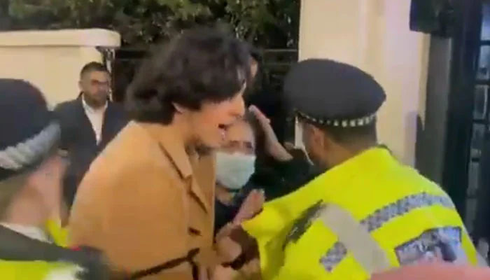 PTI supporter Shayan Ali and London police. —Screen grab/ Murtaza Ali Twitter