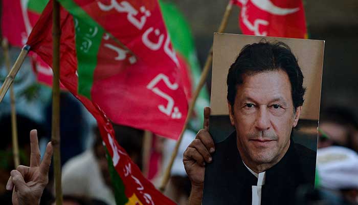 Activists of opposition party Pakistan Tehreek-e-Insaf (PTI) take part in the anti-government rally demanding early election in Karachi on October 28, 2022. — AFP/File