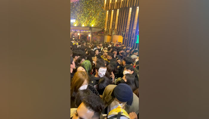 A view shows a dense crowd, during a Halloween festival in Seoul, South Korea, October 29, 2022, in this screengrab obtained from a social media video. Linda @DABAKLUSA/via Reuters