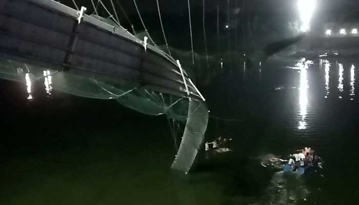 A view shows a damaged part of a suspension bridge after it collapsed in Morbi town in the western state of Gujarat, India, October 30, 2022. Reuters