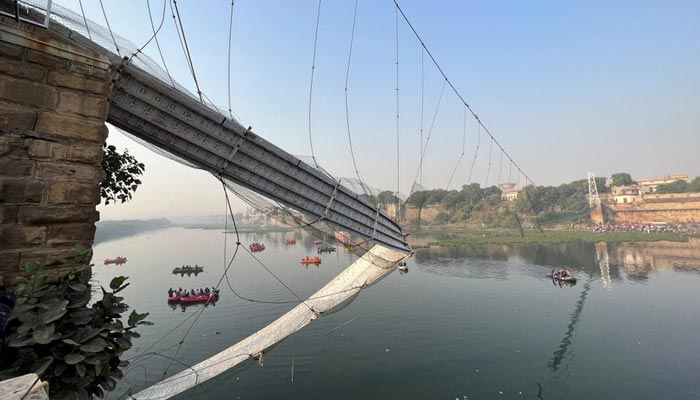 Rescuers search for survivors after a suspension bridge collapsed in Morbi town in the western state of Gujarat, India, October 31, 2022. — Reuters
