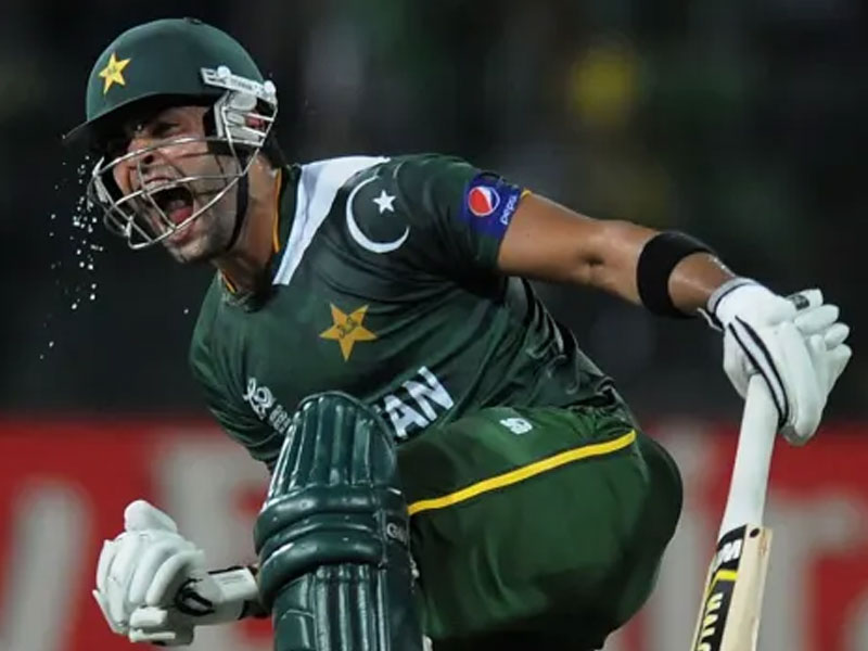 Umar Akmal celebrates a come-from-behind victory, on September 28, 2012. — AFP