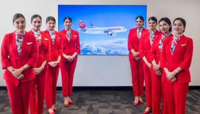 Fly Jinnah air hostesses pose ahead of its launch. — Courtesy our correspondent