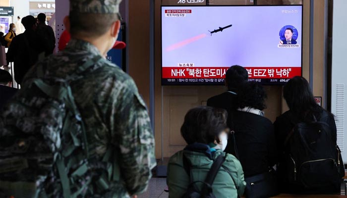 People watch a TV broadcasting a news report on North Korea firing three ballistic missiles into the sea, in Seoul, South Korea, November 2, 2022. — Reuters