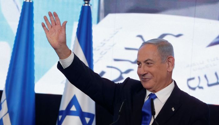 Likud party leader Benjamin Netanyahu waves as he addresses his supporters at his party headquarters during Israels general election in Jerusalem, November 2, 2022.— Reuters