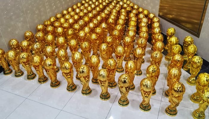 The counterfeit World Cup trophies can be seen in this handout picture. —  Twitter/MOI_QatarEn
