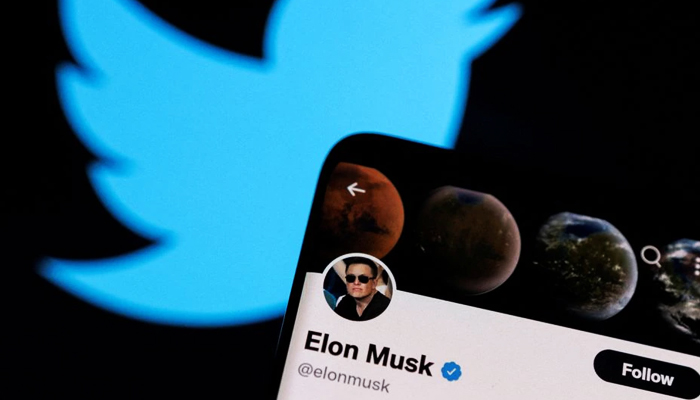 Elon Musks Twitter account is seen on a smartphone in front of the Twitter logo in this photo illustration taken, on April 15, 2022. — Reuters