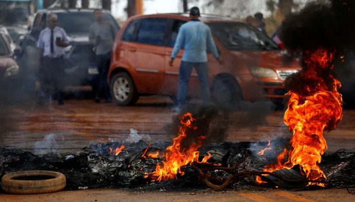 Supporters of Brazils President Jair Bolsonaro block highway BR-251 during a protest against President-elect Luiz Inacio Lula da Silva who won a third term following the presidential election run-off, in Planaltina, Brazil, October 31, 2022.— Reuters