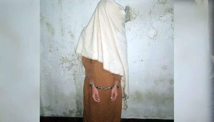 Handcuffed suspected terrorist pictured with a cloth on face to hide identity. — CTD