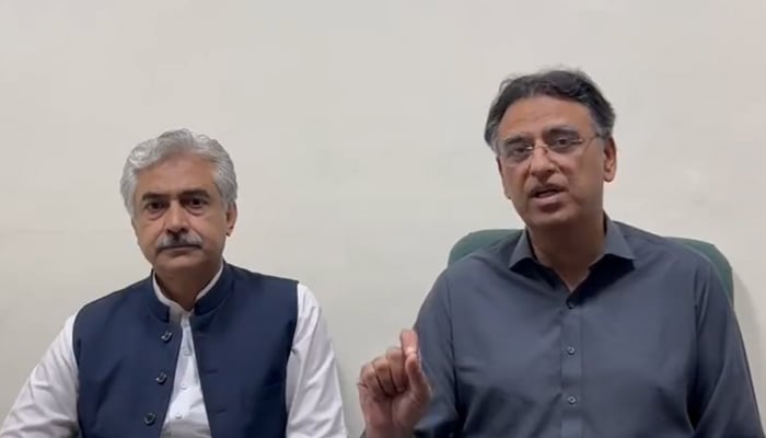 PTI Secretary-General Asad Umar (left) speaks during a video message following an attack onparty chairman Imran Khan, on November 3, 2022. — Twitter/PTI