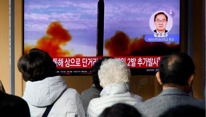 People watch a TV broadcasting a news report on North Korea firing a ballistic missile off its east coast, in Seoul, South Korea, November 3, 2022. — Reuters