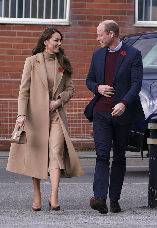 Kate Middleton seen covering her stomach during latest visit