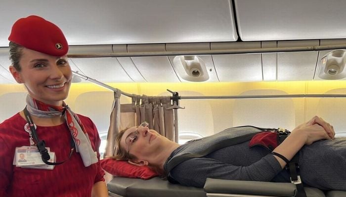 The worlds tallest womans first-ever flight.— Instagram
