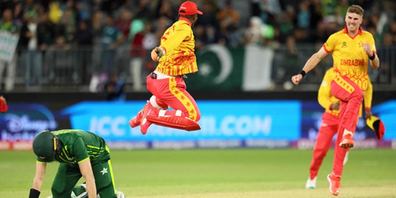 Zimbabwe´s Regis Chakabva celebrates the victory as Pakistan’s Shaheen Shah Afridi lies on the pitch at the end of the ICC Twenty20 World Cup match against Zimbabwe in Perth on October 27, 2022. — AFP