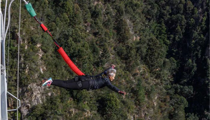 Linda Potgieter, 50, created a new record for the most bungee jumps in one hour outdoors with a 20-metre cord tied to her waist.— GWR