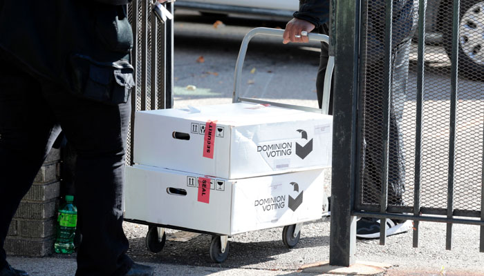 City of Detroit election workers wheel boxes of Dominion Voting equipment from the Department of Elections office in Detroit, Michigan, on November 8, 2022. AFP