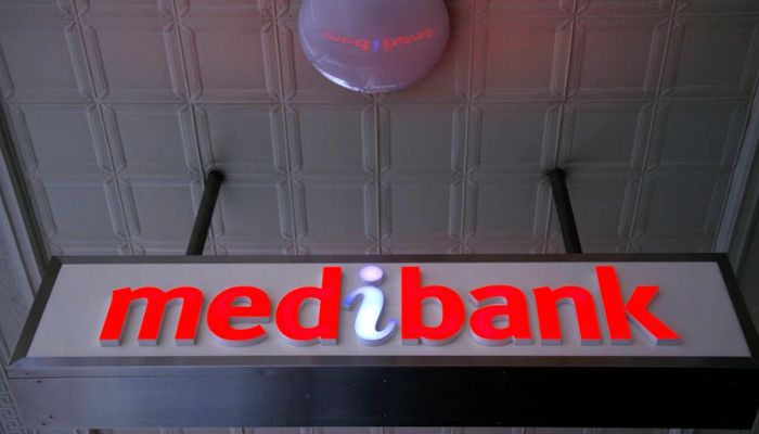 An illuminated sign is seen outside a branch of the Australian health insurer Medibank Private in Sydney October 20, 2014.— Reuters