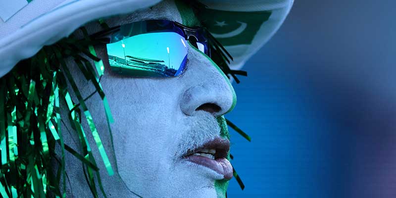 Floodlights are reflected in the sunglasses of a Pakistan supporter ahead of the start of the ICC men´s Twenty20 World Cup 2022 semi-final cricket match between New Zealand and Pakistan at the Sydney Cricket Ground in Sydney on November 9, 2022. — AFP