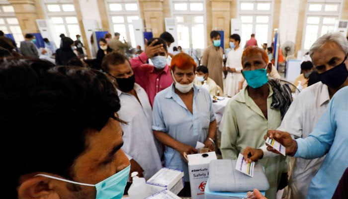 Patients gather at a counter at a public hospital in Karachi. —Reuters/File