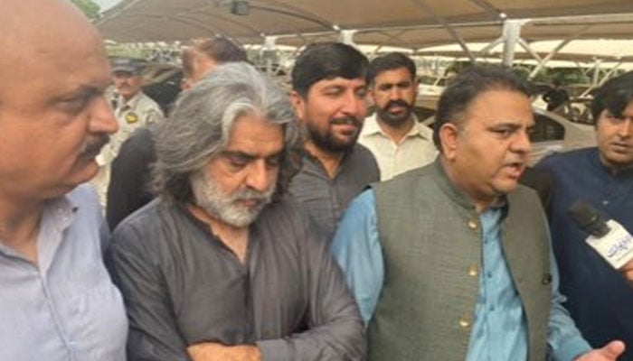 Former PTI leader Major (retd) Khurram Hameed Rokhri with Fawad Chaudhry. — Twitter