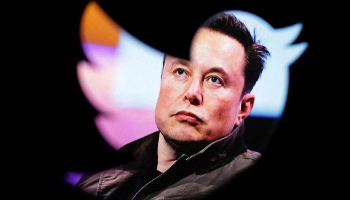 Elon Musks photo is seen through a Twitter logo in this illustration taken October 28, 2022.— Reuters