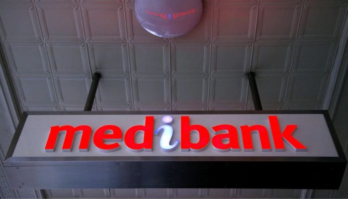 An illuminated sign is seen outside a branch of the Australian health insurer Medibank Private in Sydney October 20, 2014.— Reuters