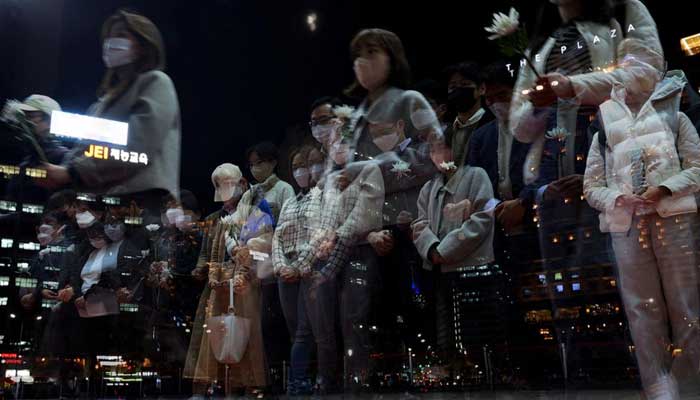 People mourn at a group memorial for the victims of the crowd crush that happened during Halloween festivities, at Seoul City Hall Plaza in Seoul, South Korea, November 3, 2022. — Reuters