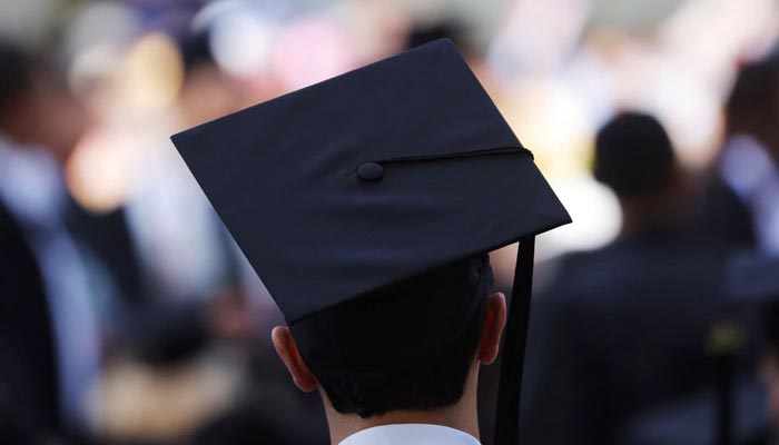 A graduating student waits for the start of the Commencement ceremony at the Massachusetts Institute of Technology (MIT) in Cambridge, Massachusetts, US, May 27, 2022. —